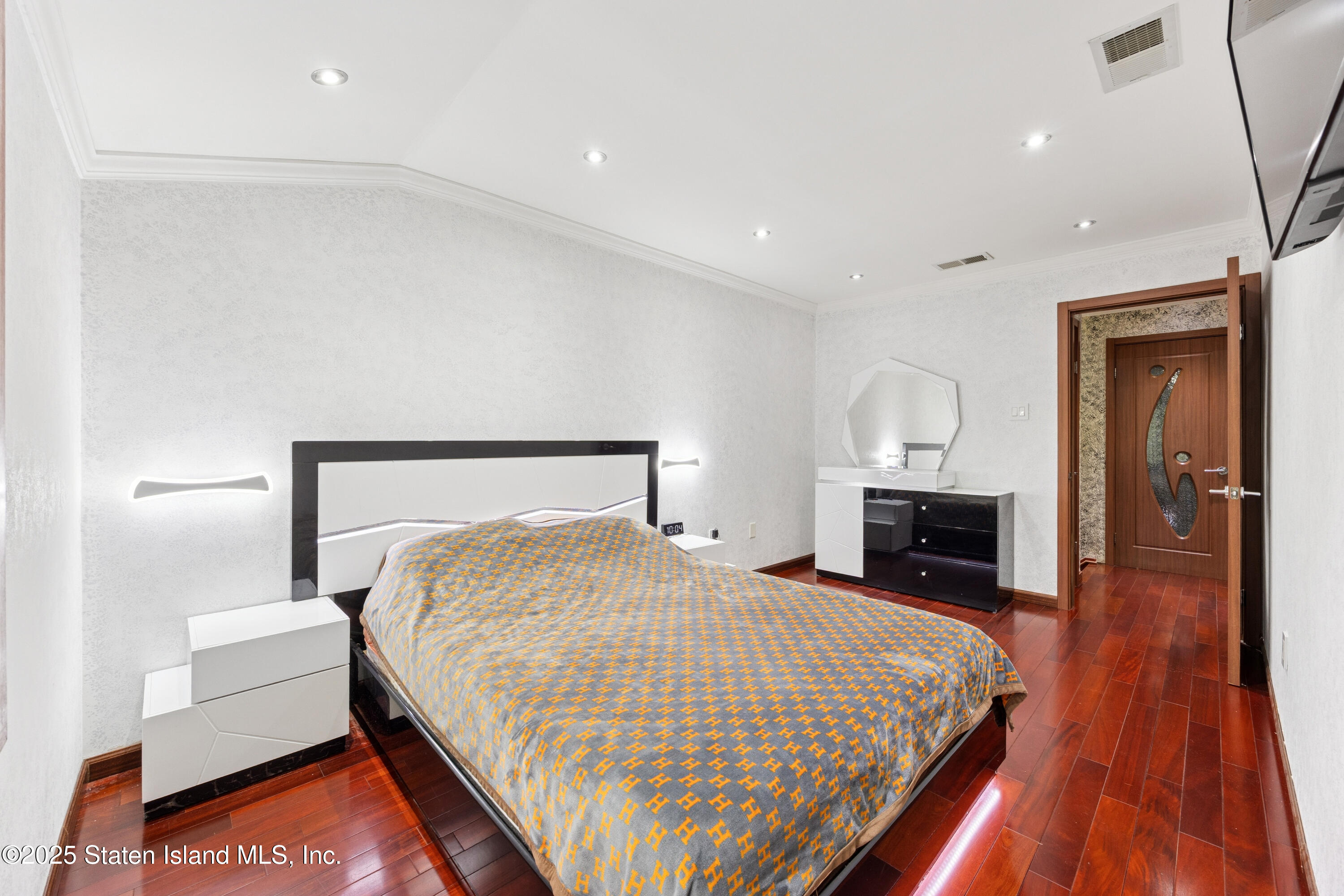 192 Ilyssa Way Staten Island, NY 10312 - Photo 15 of 25 a bedroom with a bed and a view of kitchen