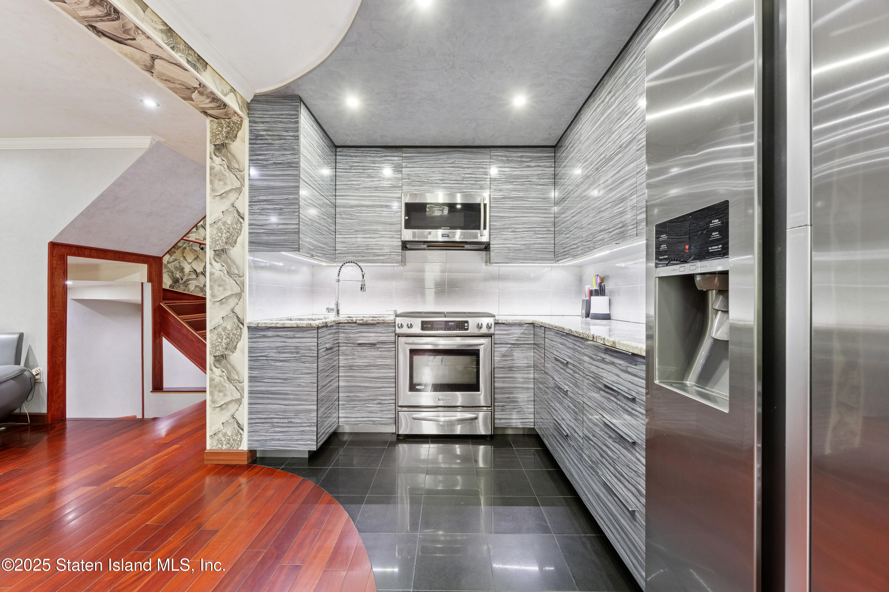 192 Ilyssa Way Staten Island, NY 10312 - Photo 9 of 25 a kitchen with stainless steel appliances granite countertop a stove and a refrigerator
