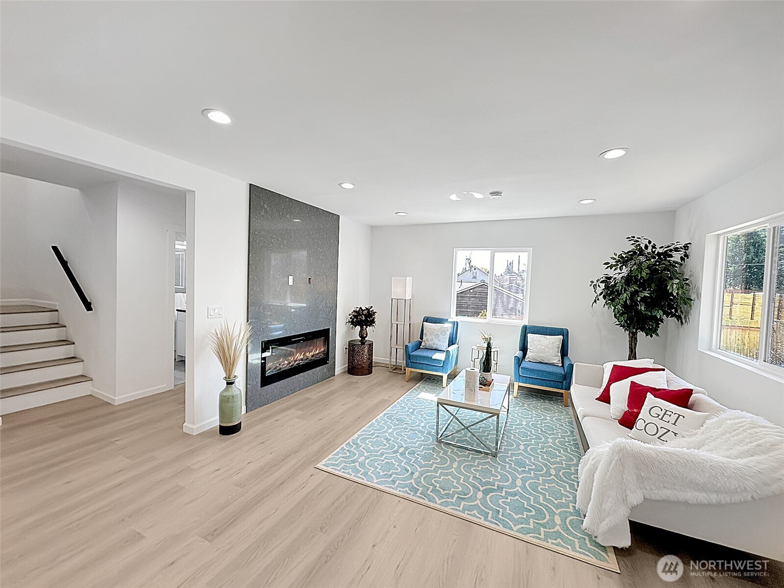 7403 Beverly Boulevard Everett, WA 98203 - Photo 2 of 19 a living room with furniture and a fireplace