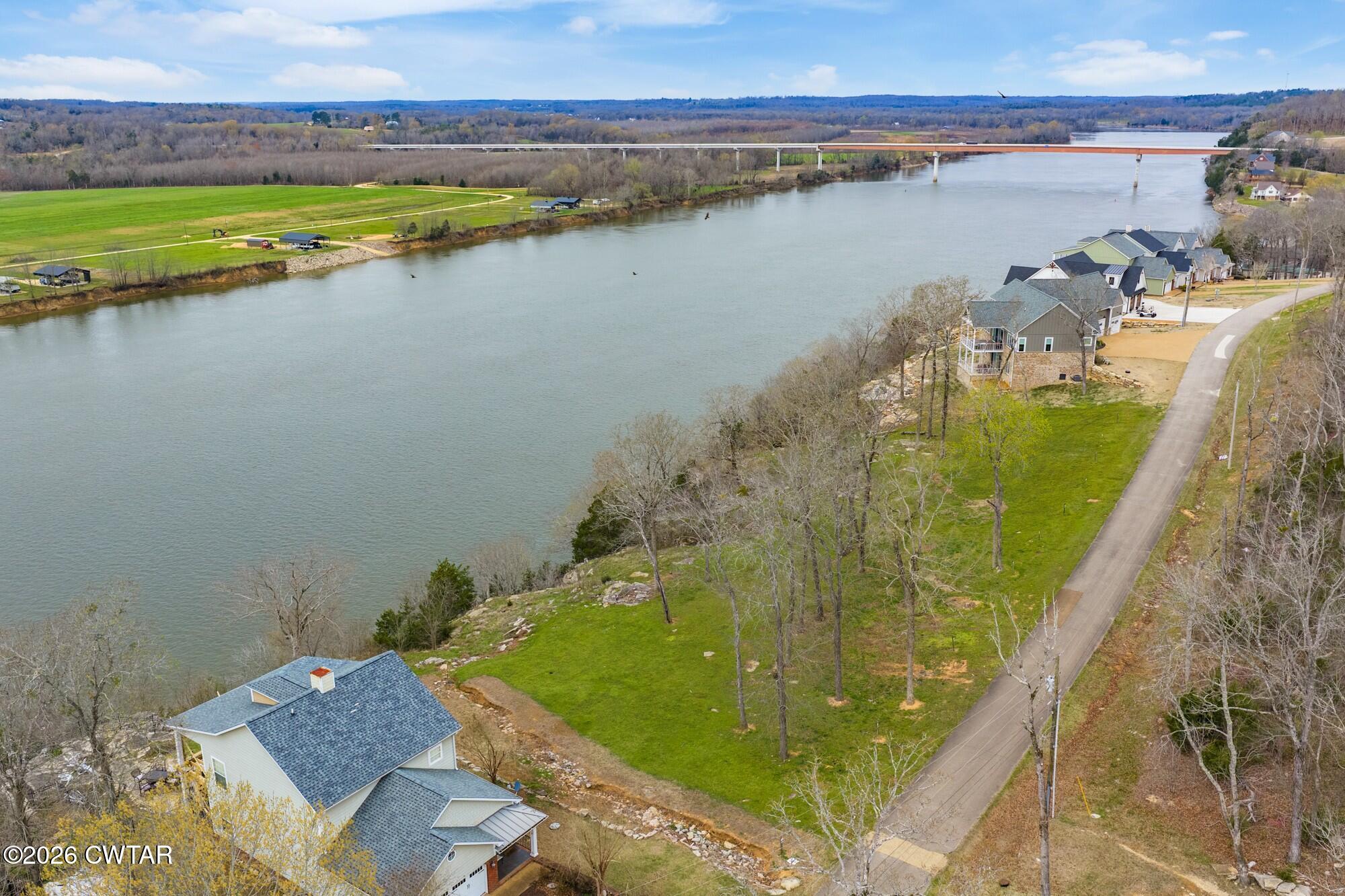 Lot 46 Adam Loop Bath Springs, TN 38311 - Photo 17 of 22 a view of a lake with a outdoor space