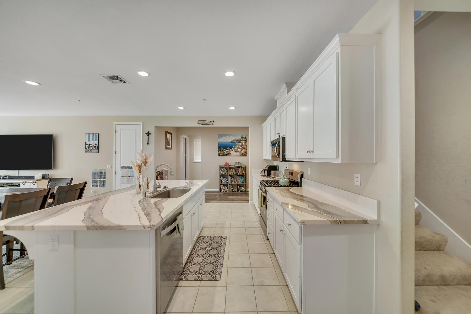 818 Stickney Way Oakley, CA 94561 - Photo 11 of 53 a large white kitchen with stainless steel appliances