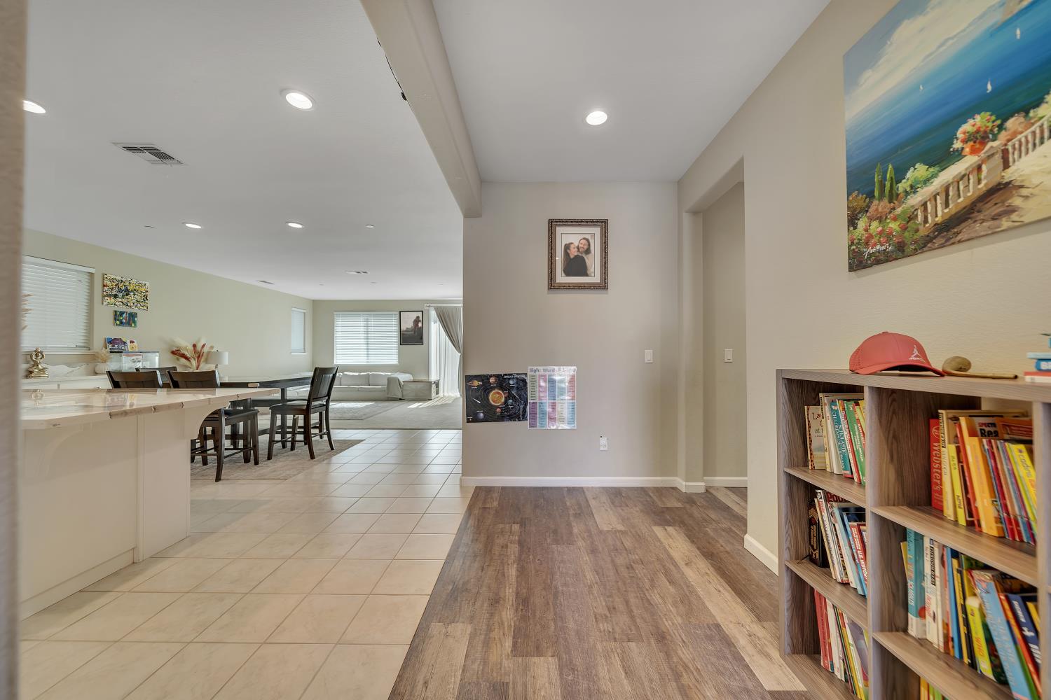 818 Stickney Way Oakley, CA 94561 - Photo 13 of 53 a dining room with furniture and a book shelf