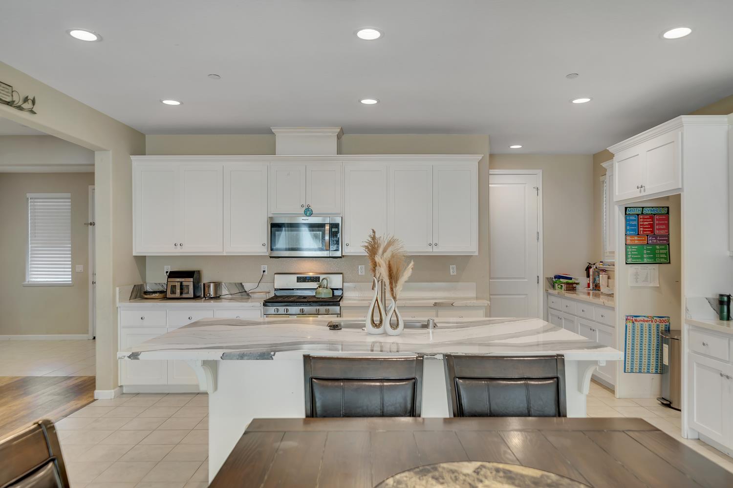 818 Stickney Way Oakley, CA 94561 - Photo 38 of 53 a kitchen with stainless steel appliances granite countertop a stove a sink and a refrigerator