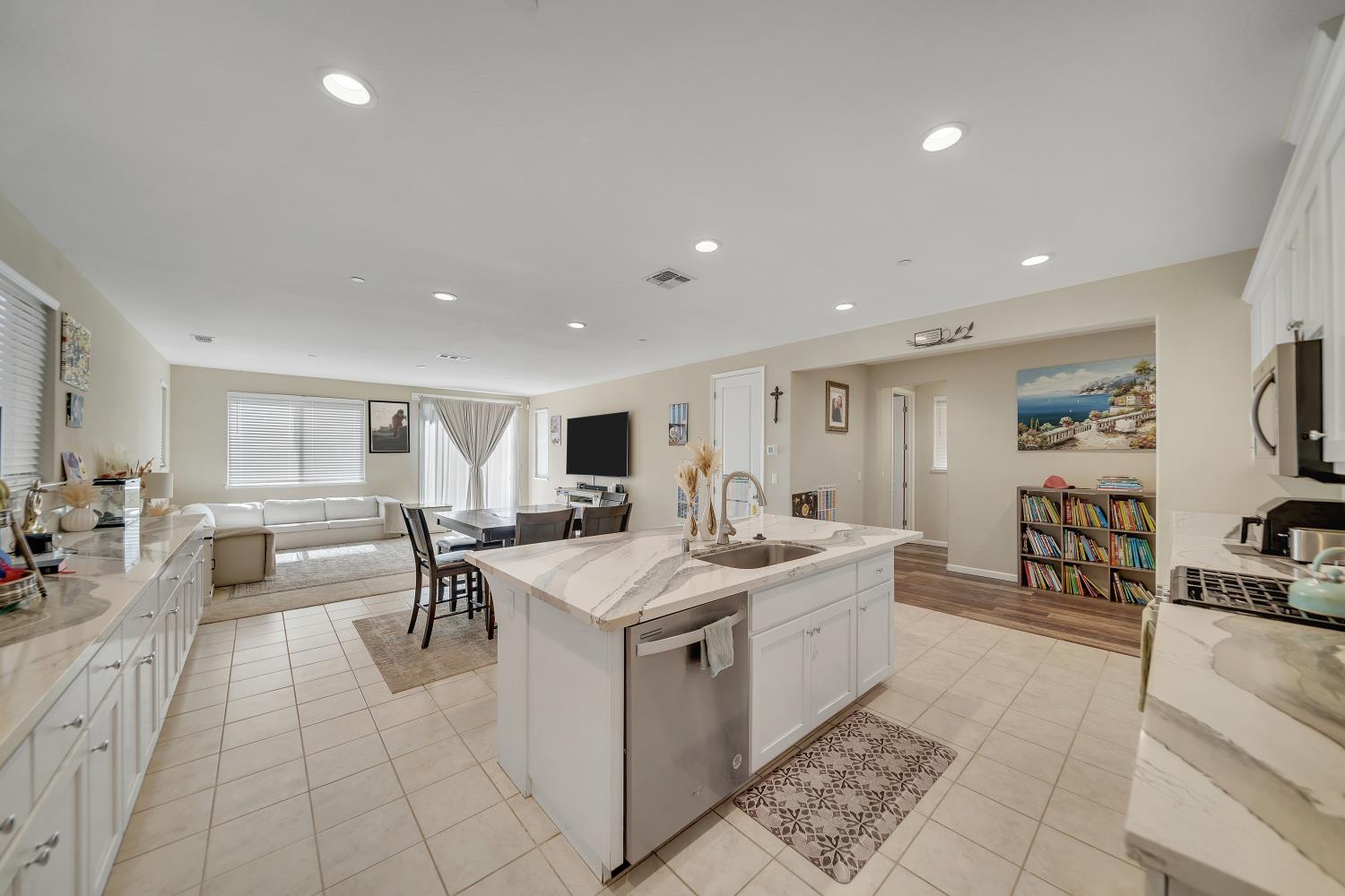 818 Stickney Way Oakley, CA 94561 - Photo 10 of 53 a living room with stainless steel appliances furniture a rug and a kitchen view