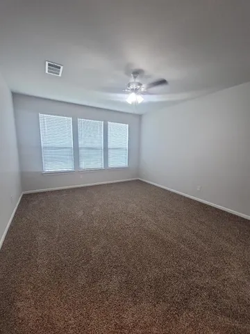 a view of empty room with windows