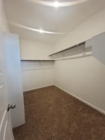 a view of a room with shelf on the wall