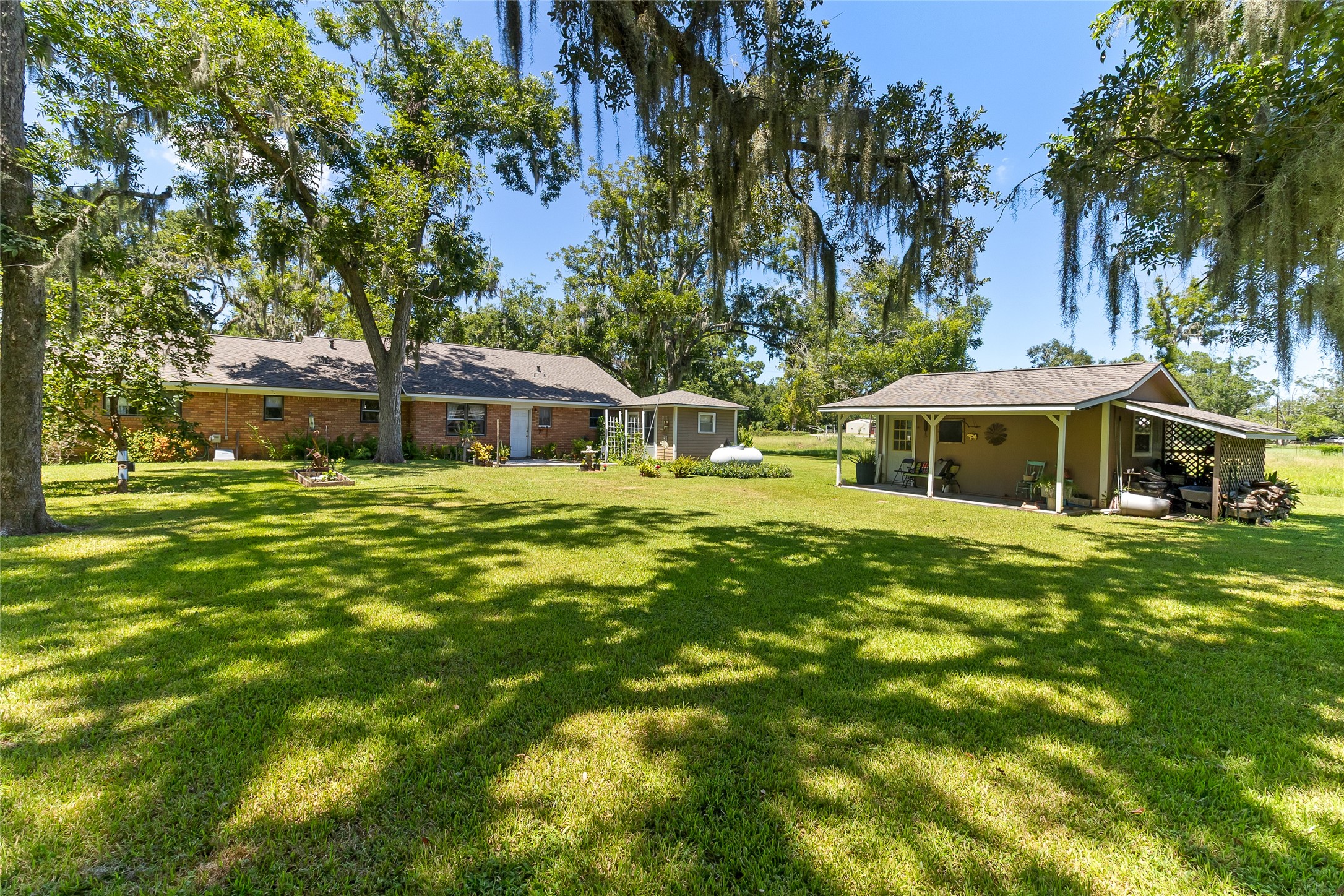 1971 FM 522 Road Brazoria, TX 77422 - Photo 4 of 26 Sprawling backyard with plenty of space to enjoy the property, while the hobby shed and workshop add valuable room for projects, tools and storage.