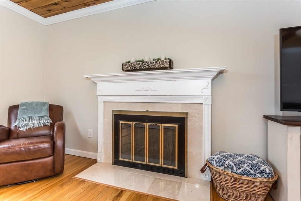 426 Coronation Drive Franklin, MA 02038 - Photo 11 of 46 a living room with furniture and a fireplace