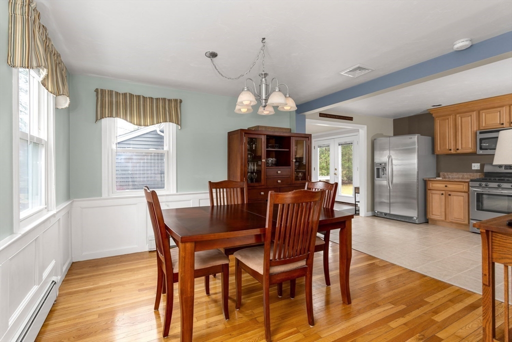426 Coronation Drive Franklin, MA 02038 - Photo 17 of 46 a view of a dining room with furniture window and wooden floor