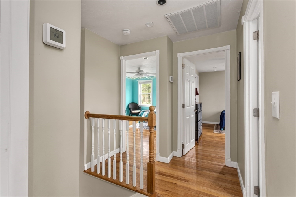 426 Coronation Drive Franklin, MA 02038 - Photo 21 of 46 a view of a hallway with a livingroom and windows