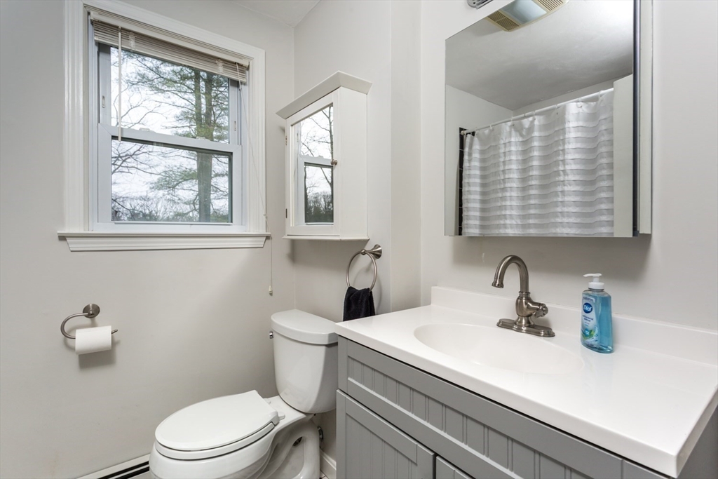 426 Coronation Drive Franklin, MA 02038 - Photo 25 of 46 a bathroom with a sink a toilet and a window