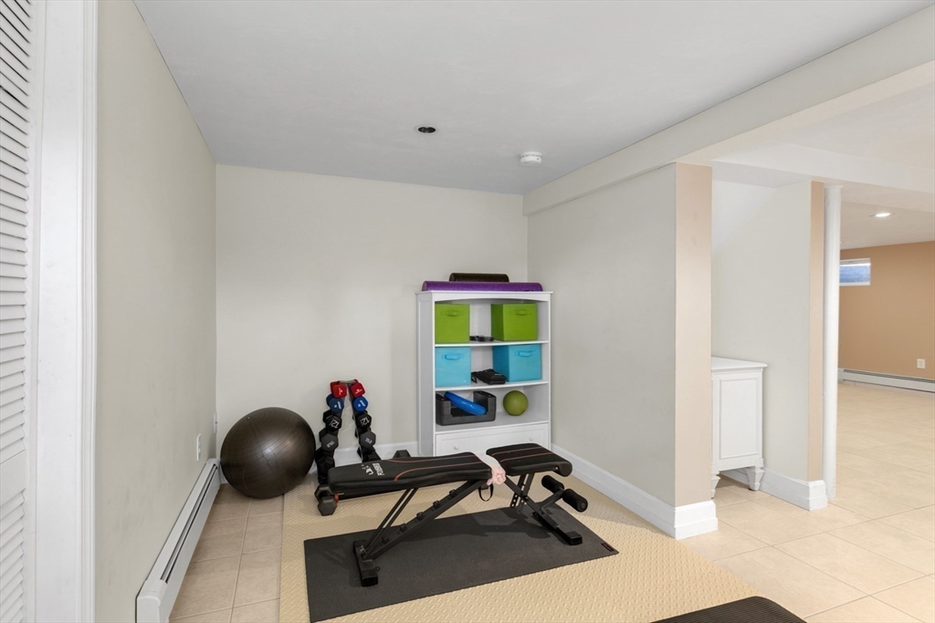 426 Coronation Drive Franklin, MA 02038 - Photo 29 of 46 a room with furniture and gym equipment