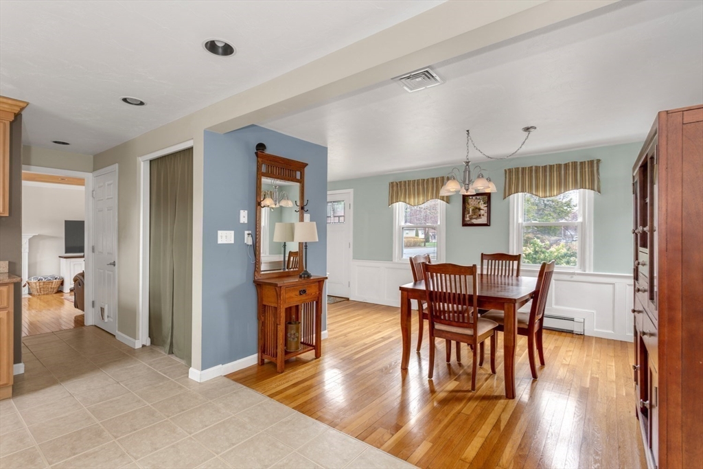 426 Coronation Drive Franklin, MA 02038 - Photo 3 of 46 a view of a dining room with furniture and wooden floor