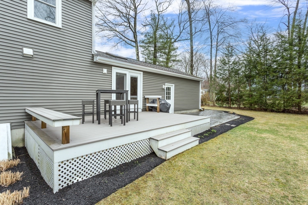 426 Coronation Drive Franklin, MA 02038 - Photo 33 of 46 a view of a patio with a table and chairs