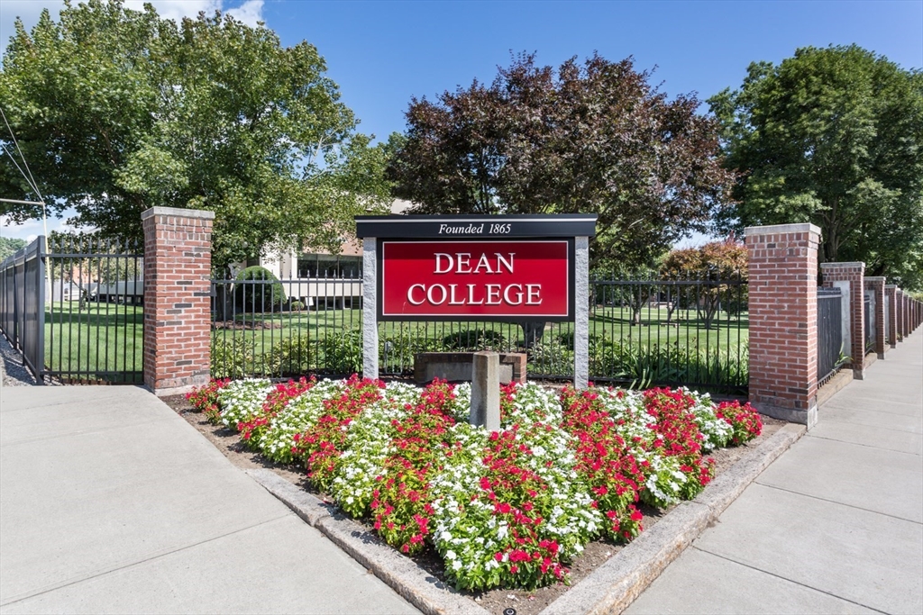 426 Coronation Drive Franklin, MA 02038 - Photo 41 of 46 a sign on the side of the wall