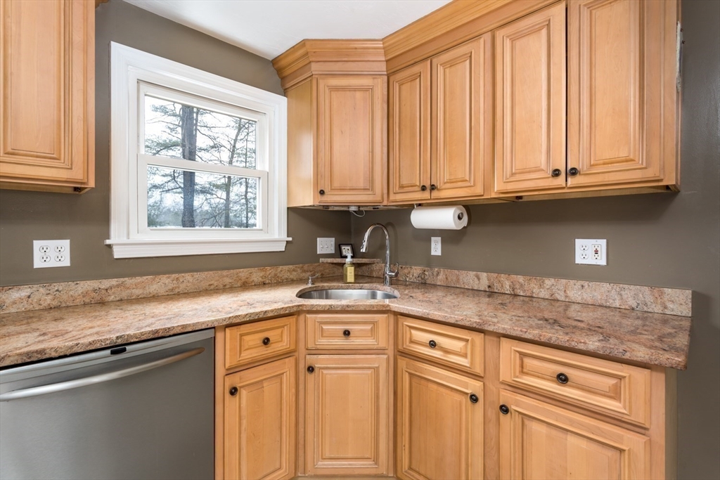426 Coronation Drive Franklin, MA 02038 - Photo 8 of 46 a kitchen with granite countertop stainless steel appliances white cabinets and a window