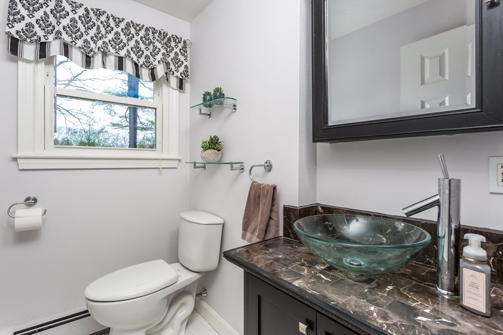 426 Coronation Drive Franklin, MA 02038 - Photo 10 of 46 a bathroom with a granite countertop toilet and a sink