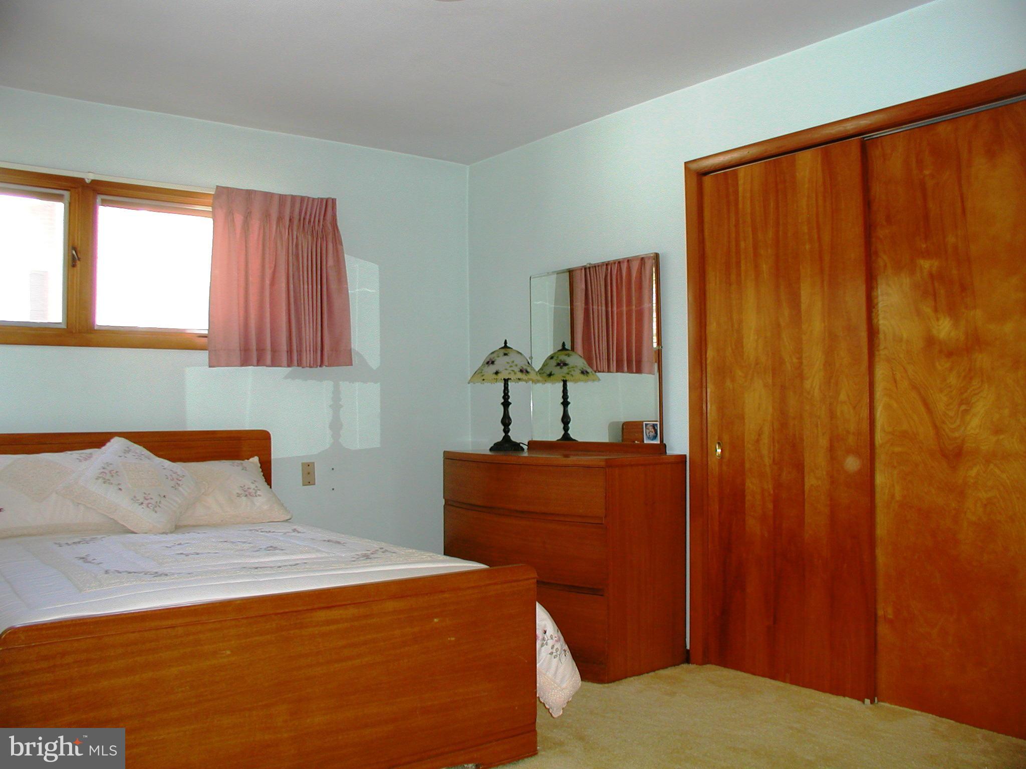 8834 Yellow Springs Road Frederick, MD 21702 - Photo 12 of 24 a bedroom with a bed and a window