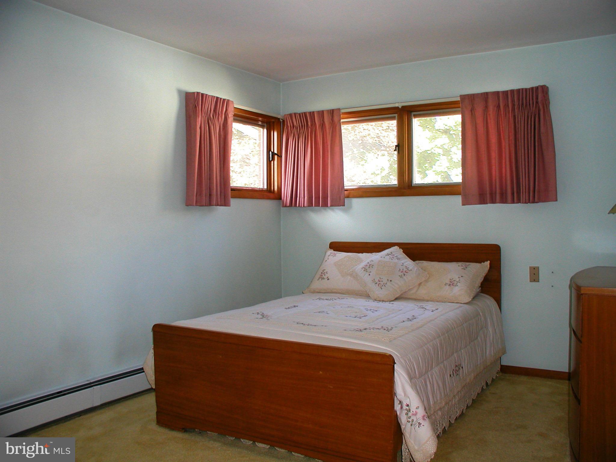 8834 Yellow Springs Road Frederick, MD 21702 - Photo 13 of 24 a bedroom with a bed and window