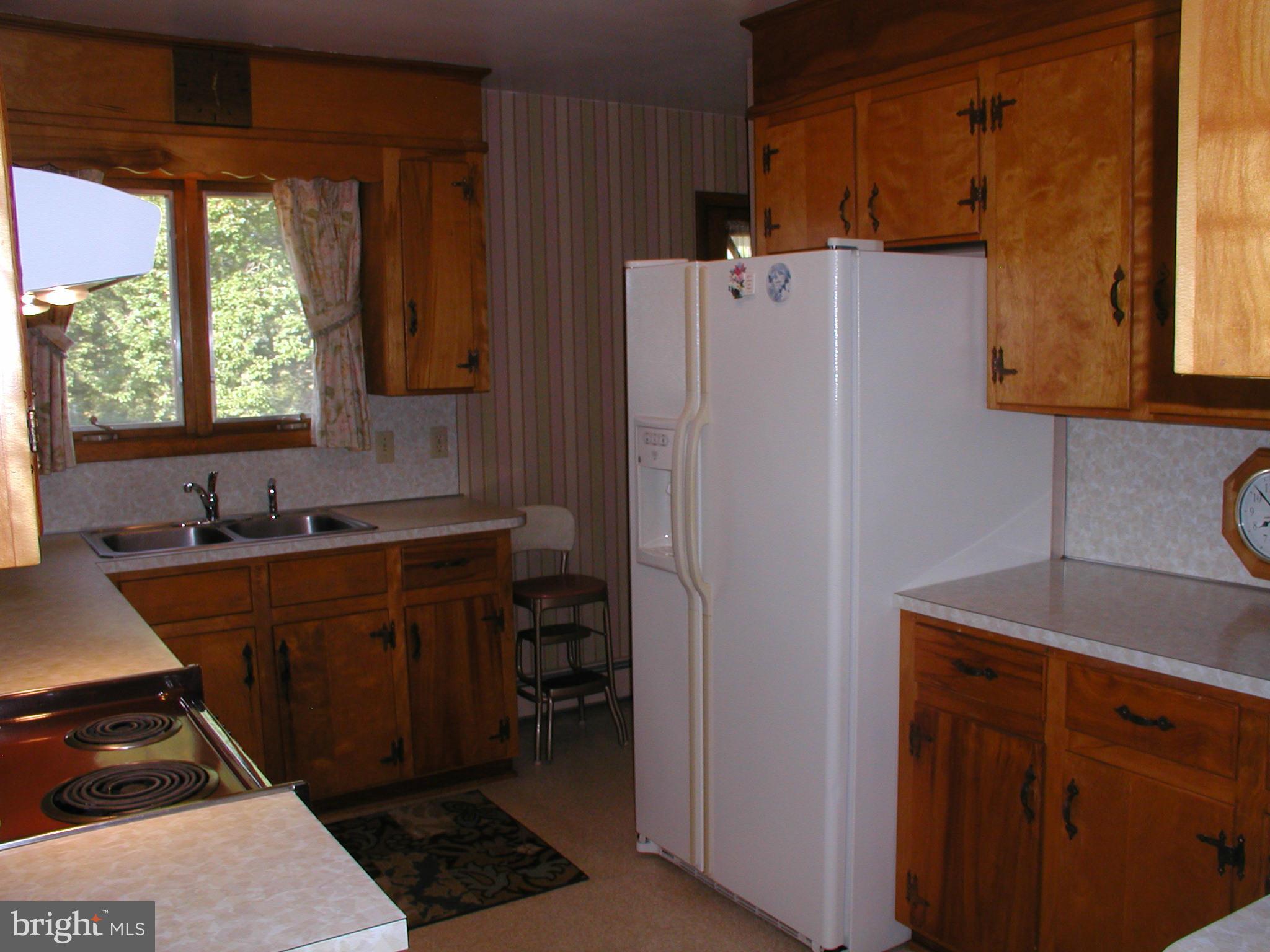 8834 Yellow Springs Road Frederick, MD 21702 - Photo 17 of 24 a room with refrigerator and window