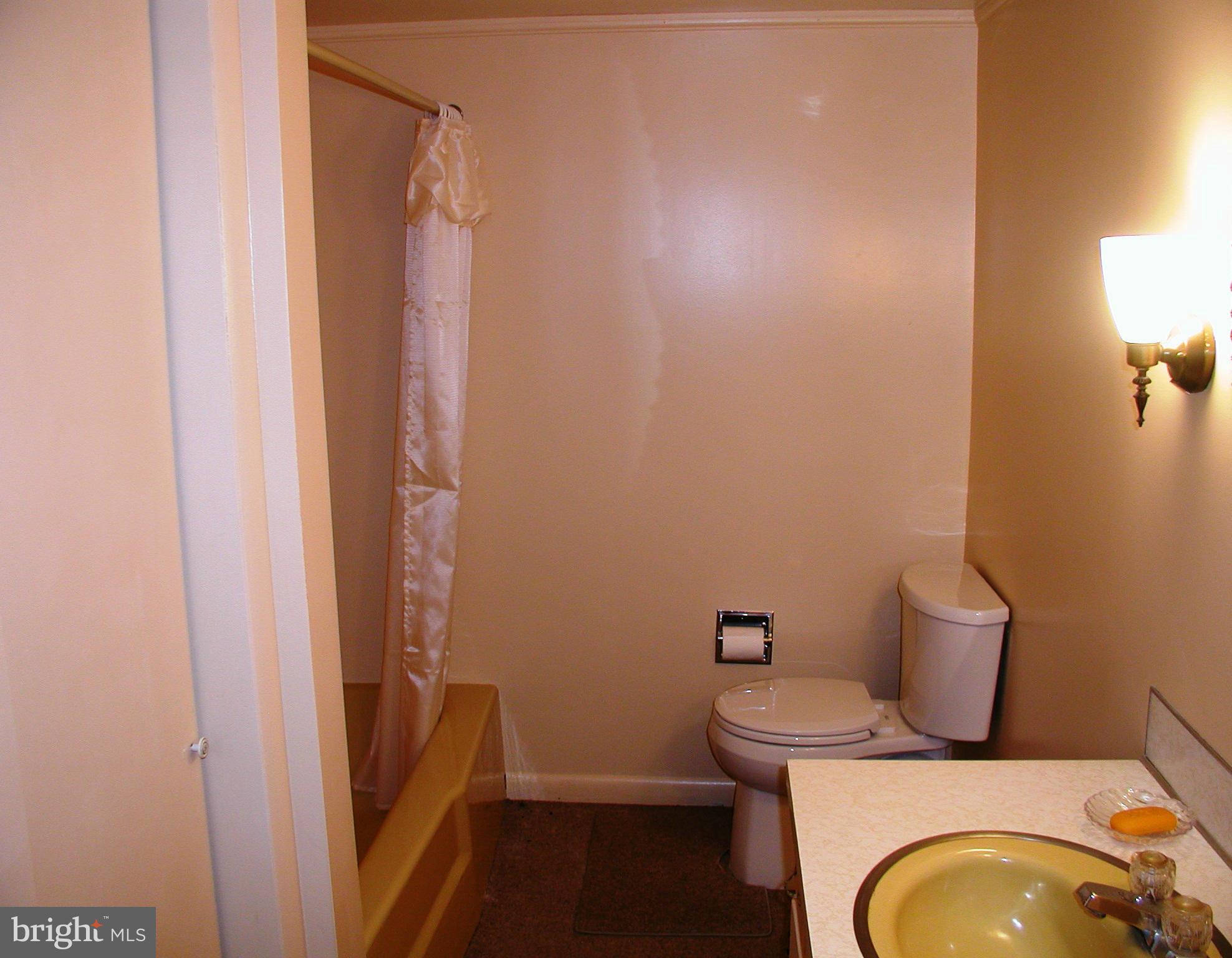 8834 Yellow Springs Road Frederick, MD 21702 - Photo 19 of 24 a bathroom with a granite countertop toilet and a sink