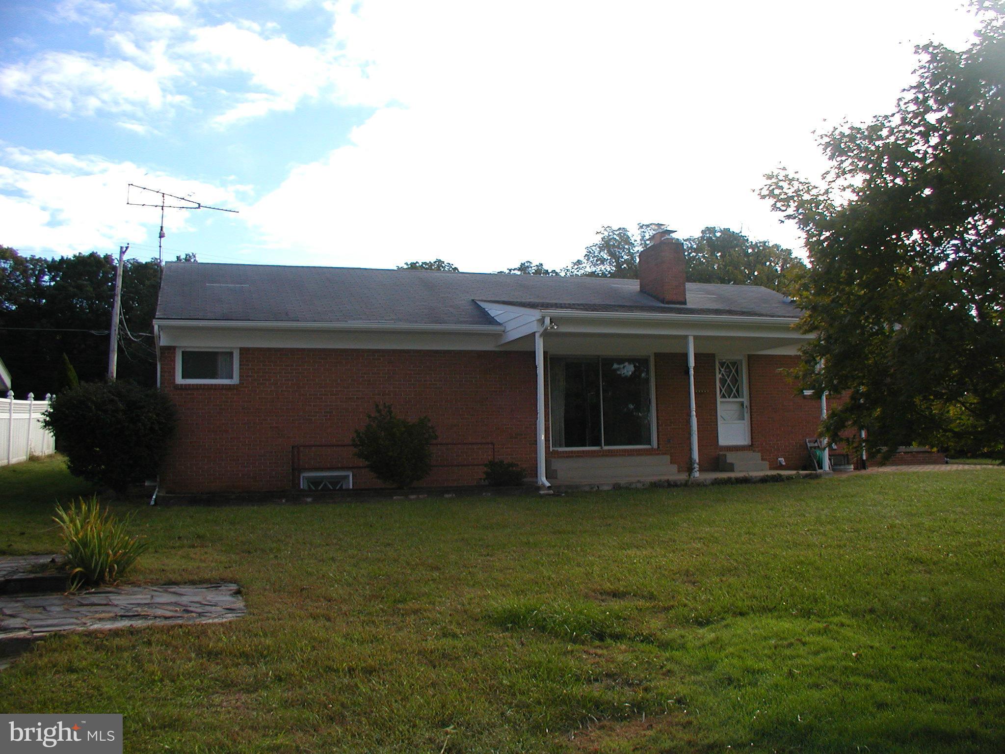 8834 Yellow Springs Road Frederick, MD 21702 - Photo 3 of 24 a front view of a house with a garden