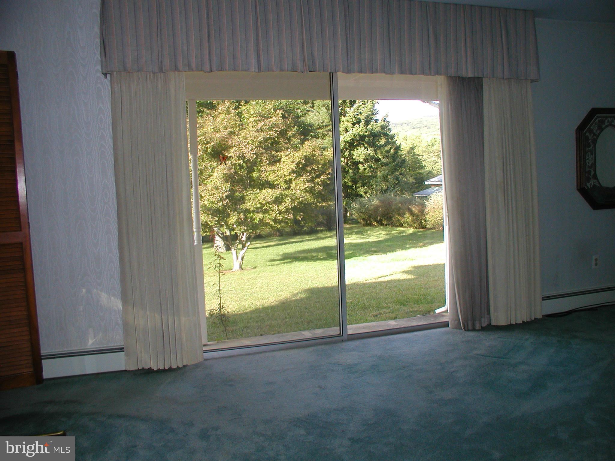 8834 Yellow Springs Road Frederick, MD 21702 - Photo 8 of 24 a view of a room with a large window and kitchen view