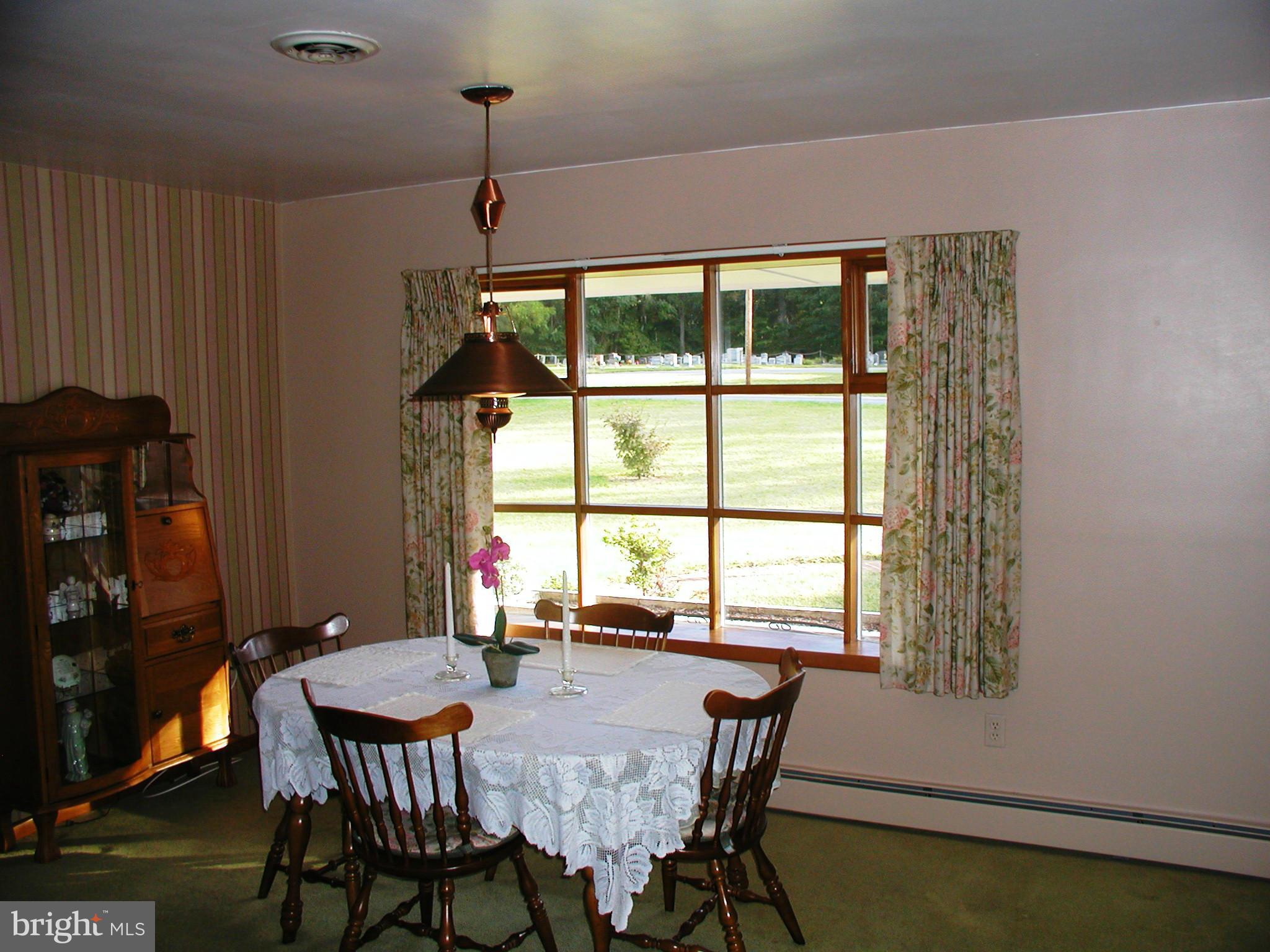 8834 Yellow Springs Road Frederick, MD 21702 - Photo 9 of 24 a view of a dining room with furniture window and outside view