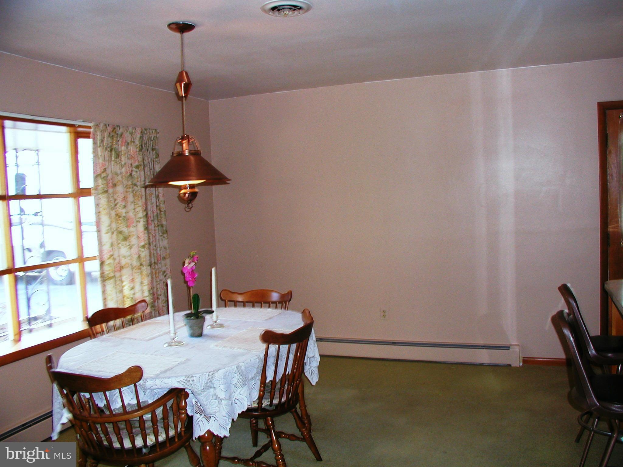 8834 Yellow Springs Road Frederick, MD 21702 - Photo 10 of 24 a view of a dining room with furniture and window