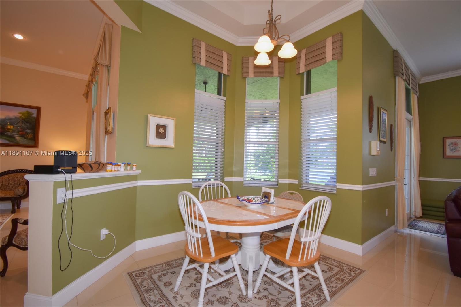 4240 Southwest 131st Avenue Davie, FL 33330 - Photo 13 of 47 a dining room with furniture and window