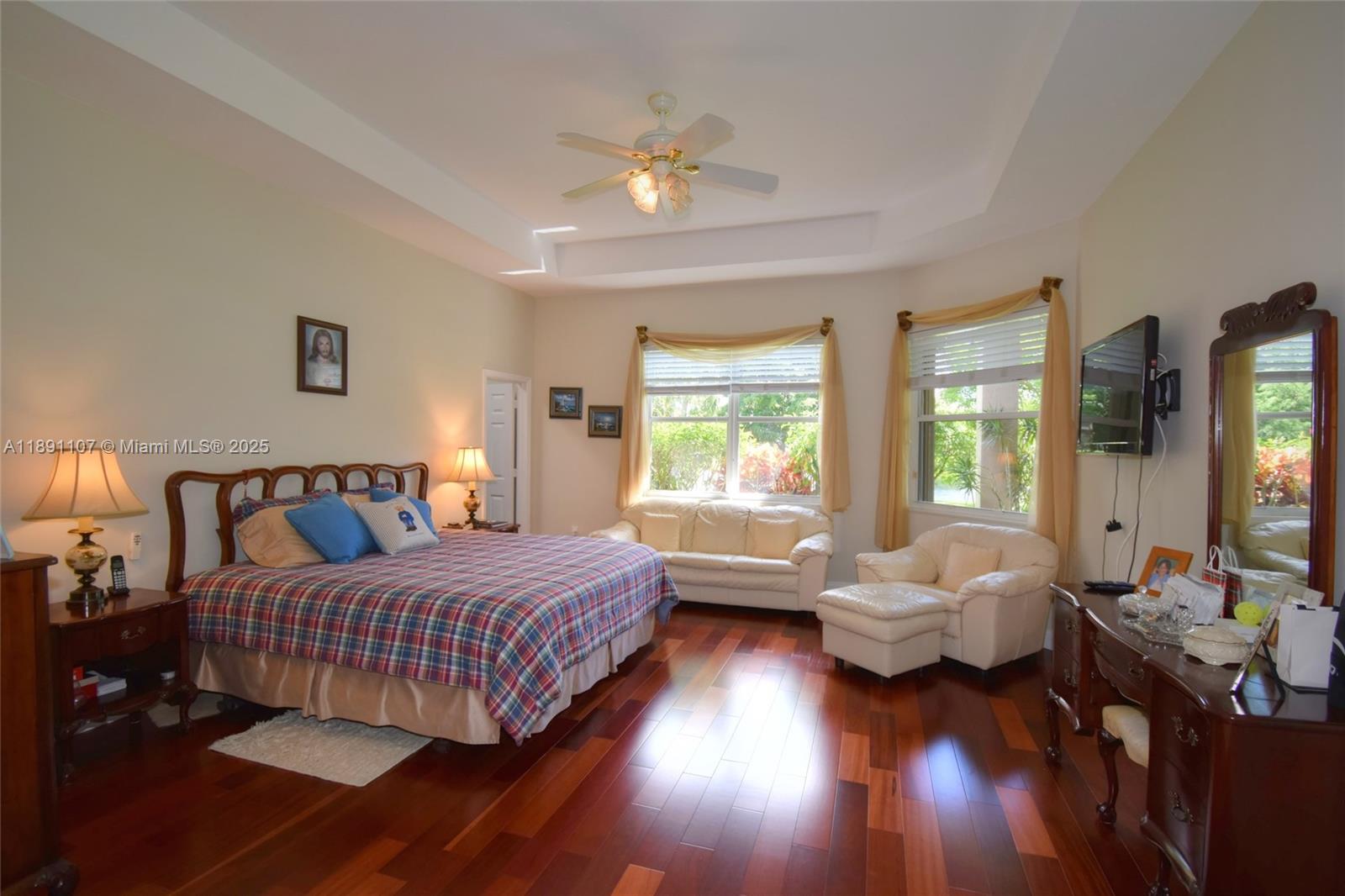 4240 Southwest 131st Avenue Davie, FL 33330 - Photo 19 of 47 a bedroom with a bed and a chandelier