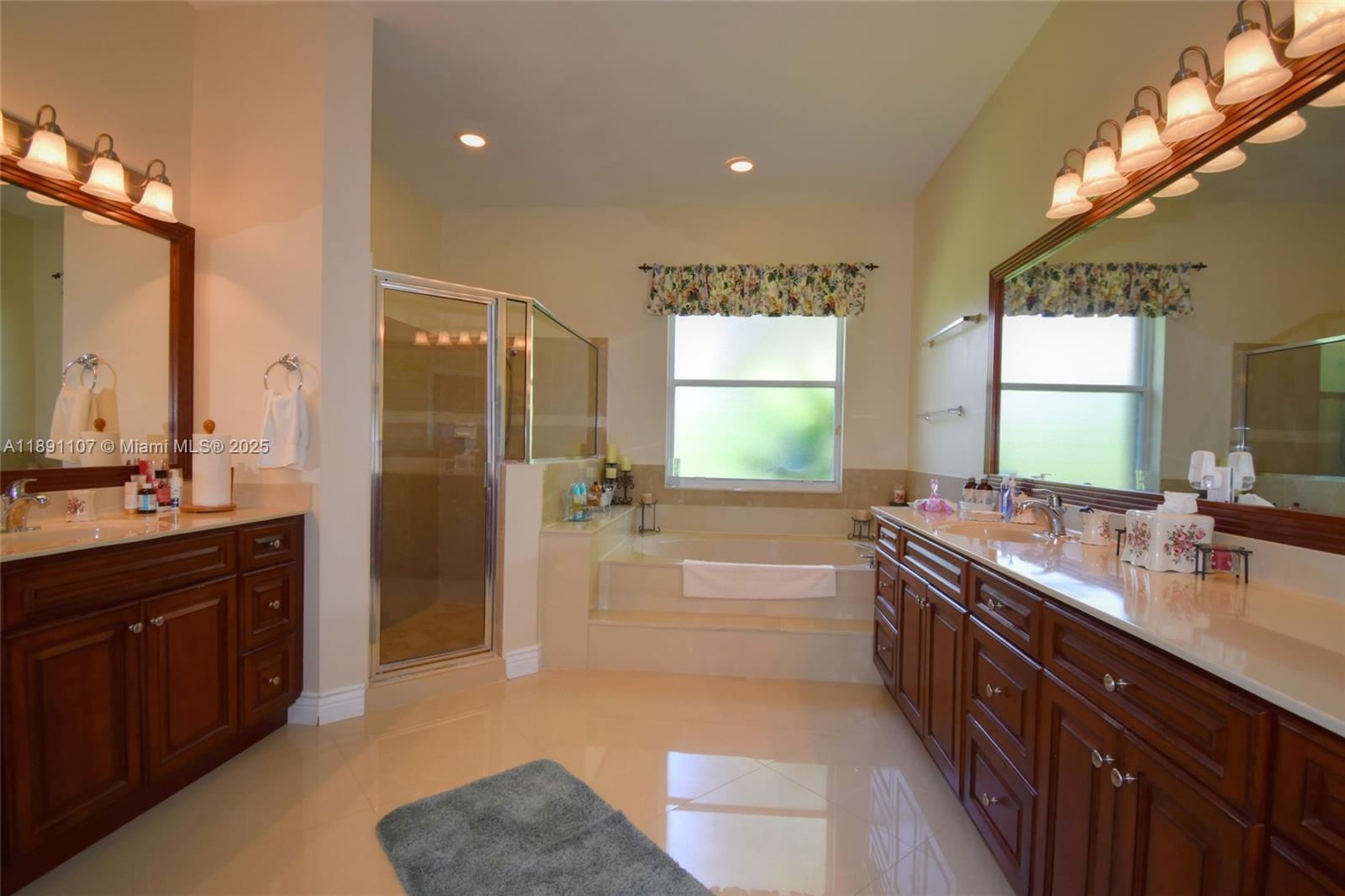 4240 Southwest 131st Avenue Davie, FL 33330 - Photo 22 of 47 a bathroom with a tub sink shower and a mirror