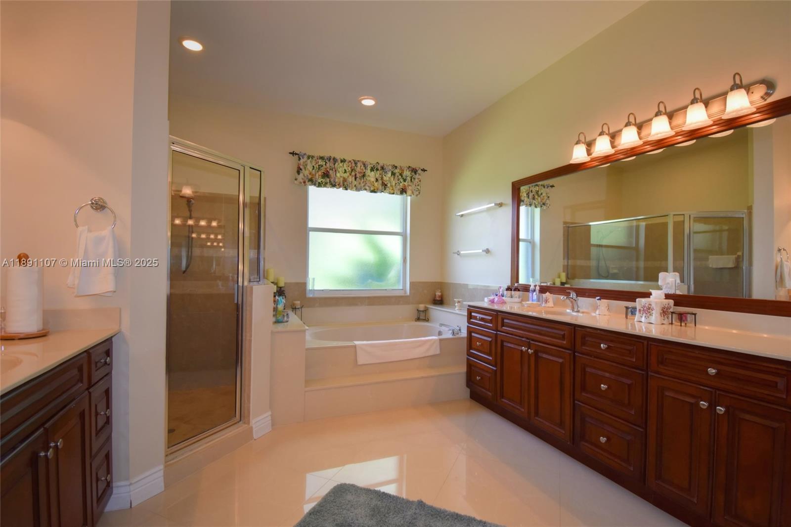 4240 Southwest 131st Avenue Davie, FL 33330 - Photo 23 of 47 a spacious bathroom with a tub sink shower and mirror