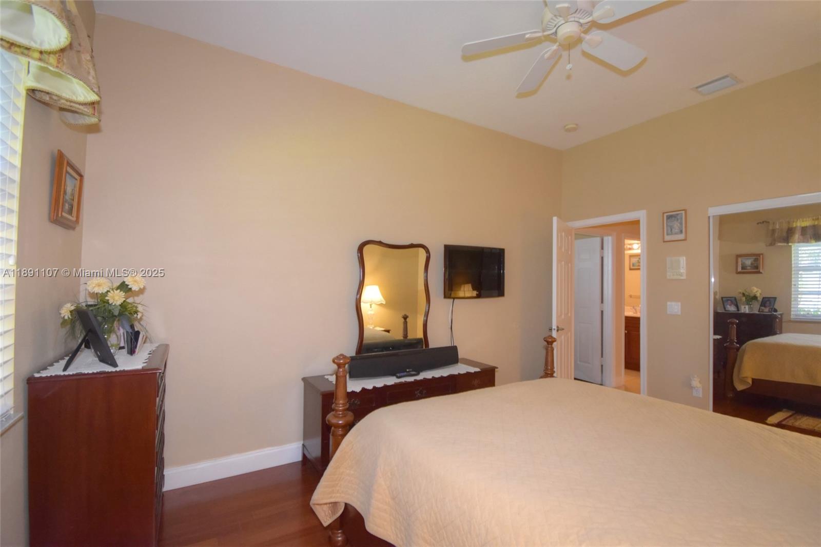 4240 Southwest 131st Avenue Davie, FL 33330 - Photo 26 of 47 a bedroom with a bed and a potted plant