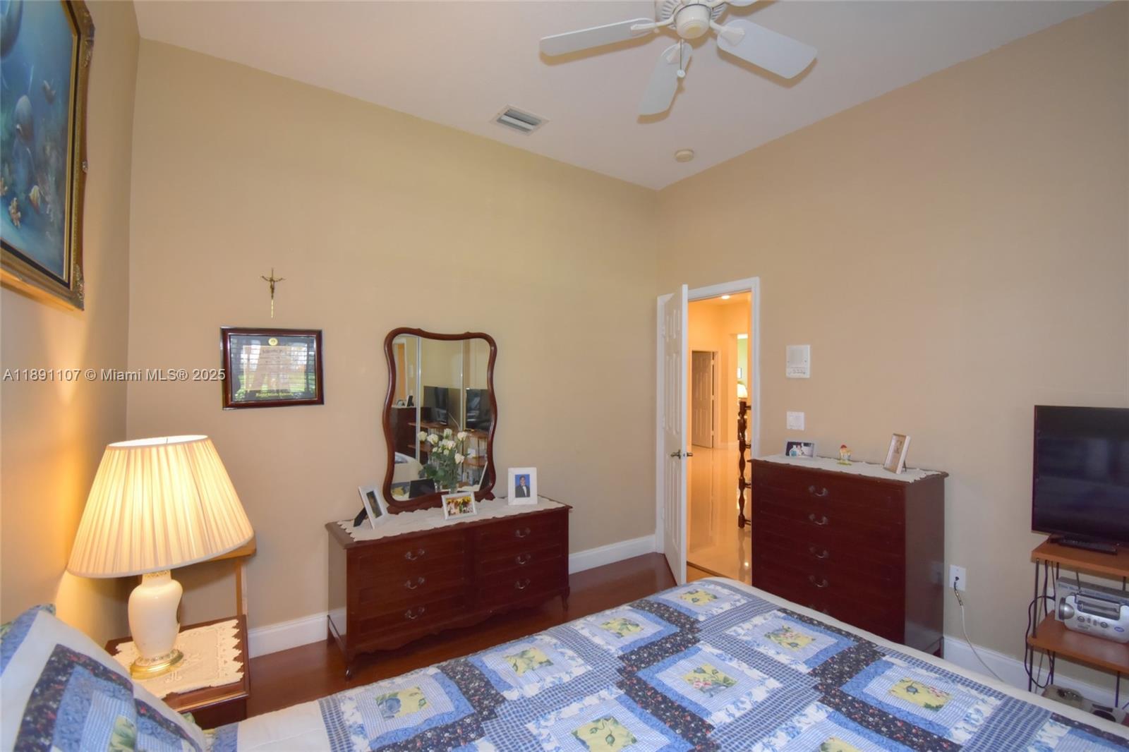 4240 Southwest 131st Avenue Davie, FL 33330 - Photo 29 of 47 a bedroom with a bed and a flat screen tv