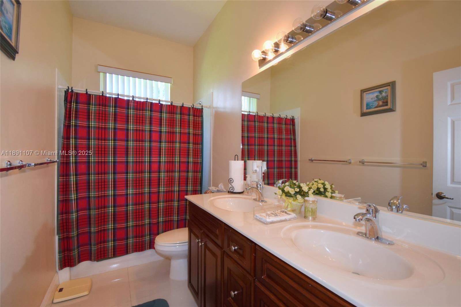 4240 Southwest 131st Avenue Davie, FL 33330 - Photo 30 of 47 a bathroom with a sink a toilet and shower