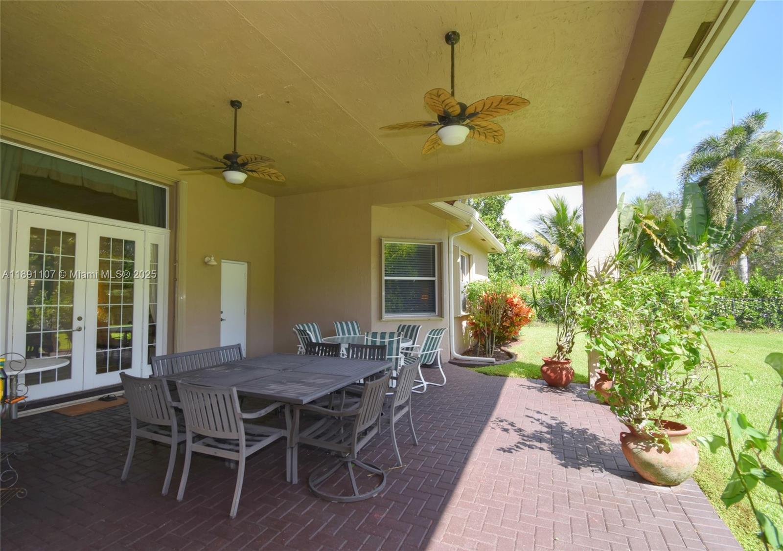 4240 Southwest 131st Avenue Davie, FL 33330 - Photo 35 of 47 a view of a dining room with furniture and chandelier