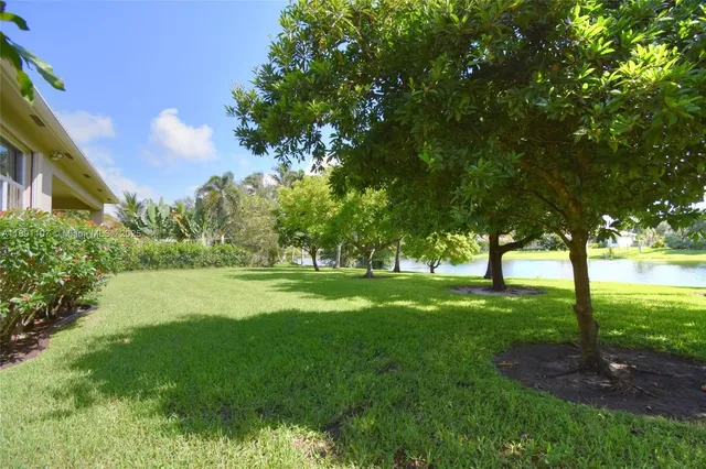 a view of a big yard next to a house