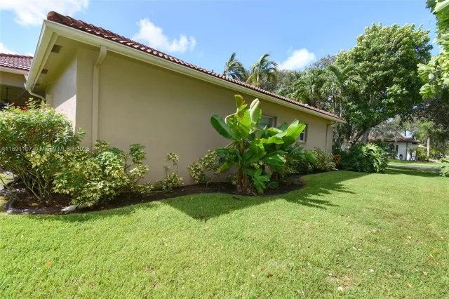 a backyard of a house with lots of green space