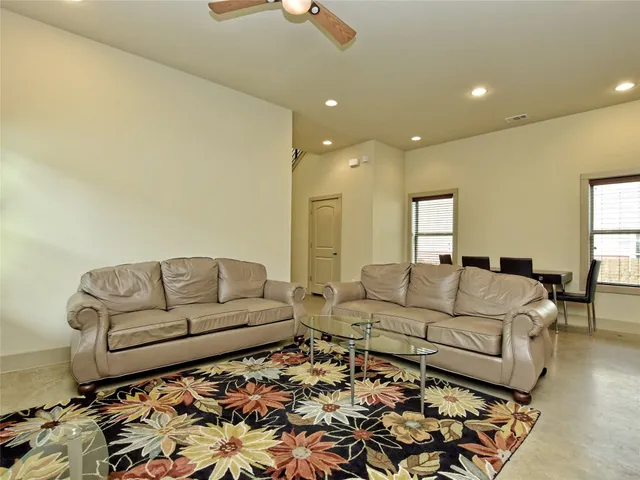 a living room with furniture and a couch