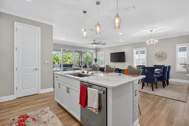 a living room with furniture a window and a flat screen tv