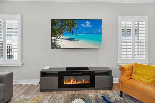 a bed room with a bed and a chandelier