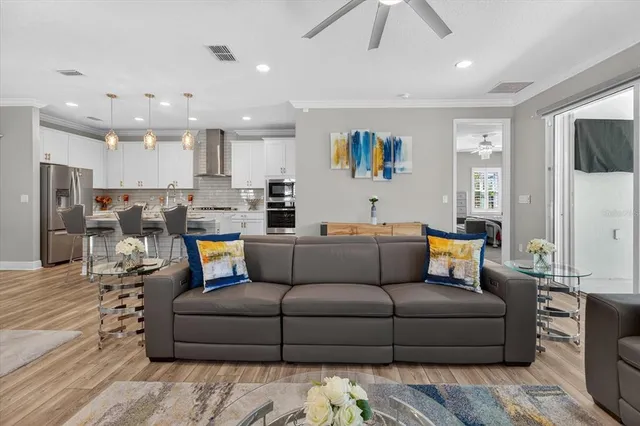 a bed room with a bed and a chandelier