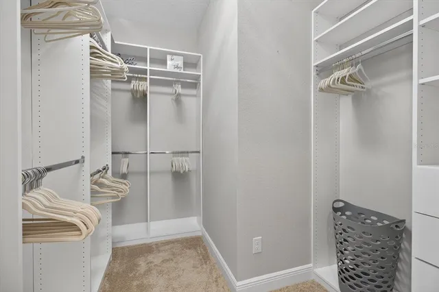 a white toilet sitting next to a bathroom and sink