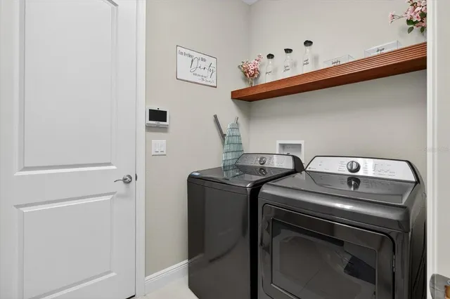 a view of a house with a backyard and a garden