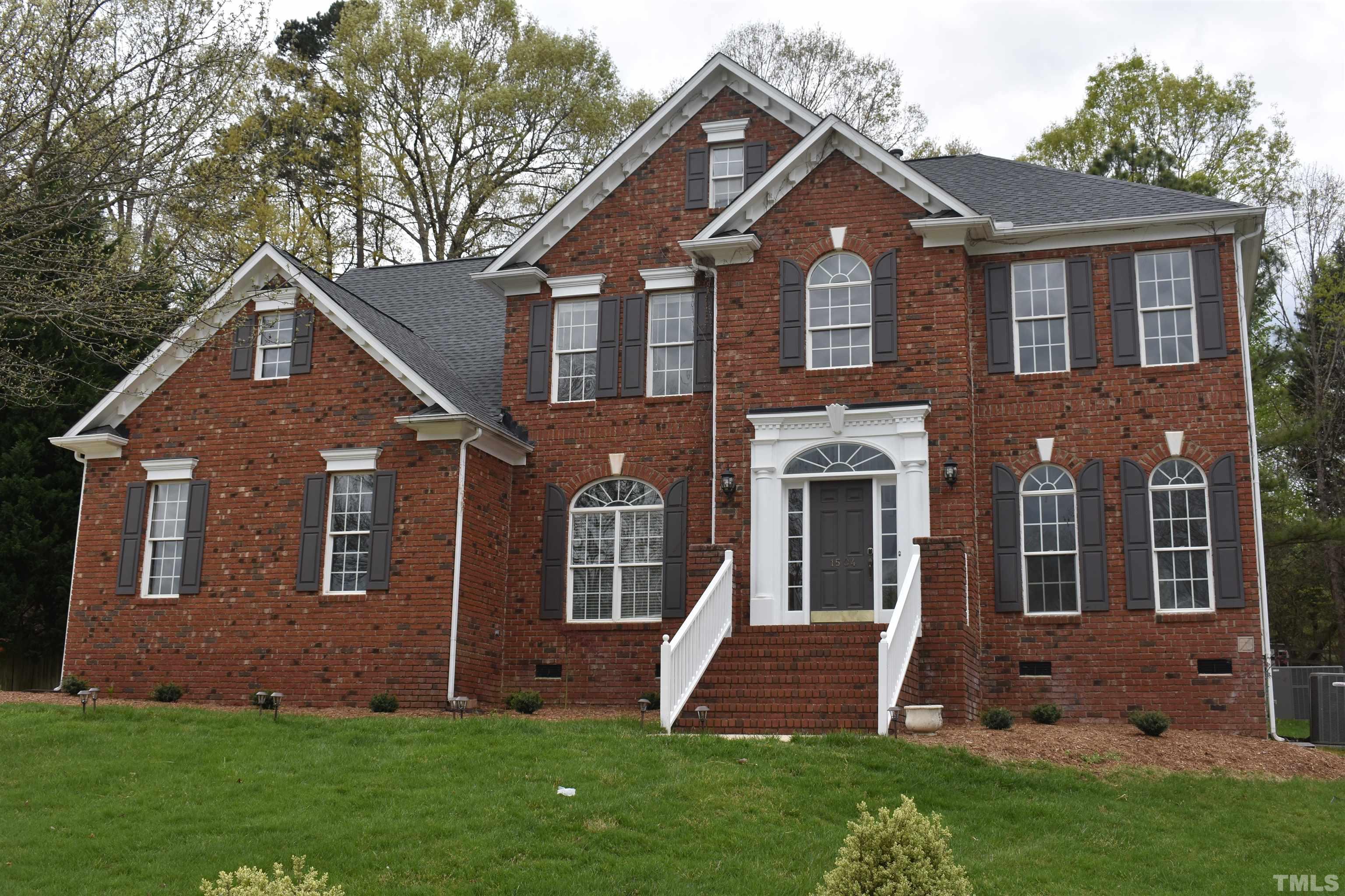 1504 Wood Spring Court Raleigh, NC 27614 - Photo 1 of 17 front view of a house with a yard