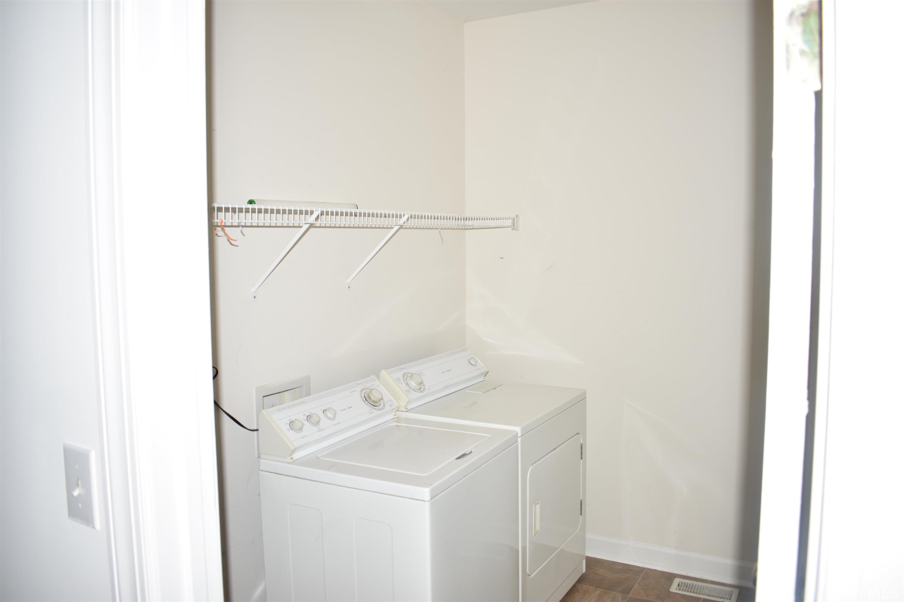 1504 Wood Spring Court Raleigh, NC 27614 - Photo 7 of 17 a utility room with dryer and washer