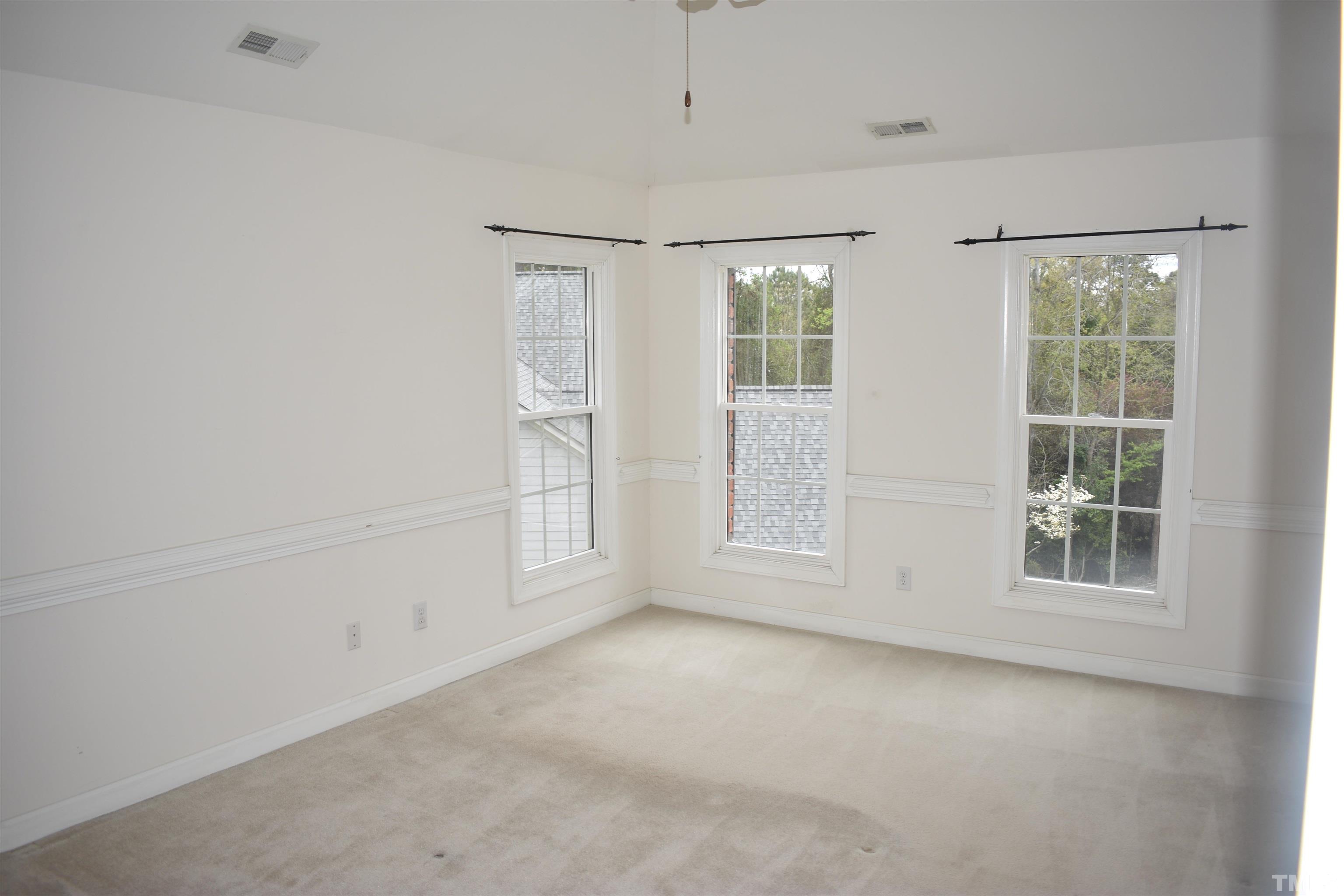 1504 Wood Spring Court Raleigh, NC 27614 - Photo 9 of 17 an empty room with windows and closet