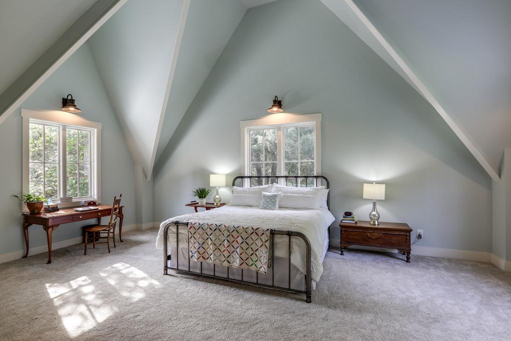 7833 Fernvale Road Fairview, TN 37062 - Photo 14 of 30 a bedroom with a bed and a chandelier
