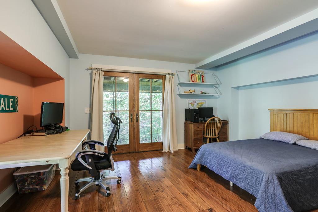 7833 Fernvale Road Fairview, TN 37062 - Photo 22 of 30 a bedroom with a bed and a desk next to a window